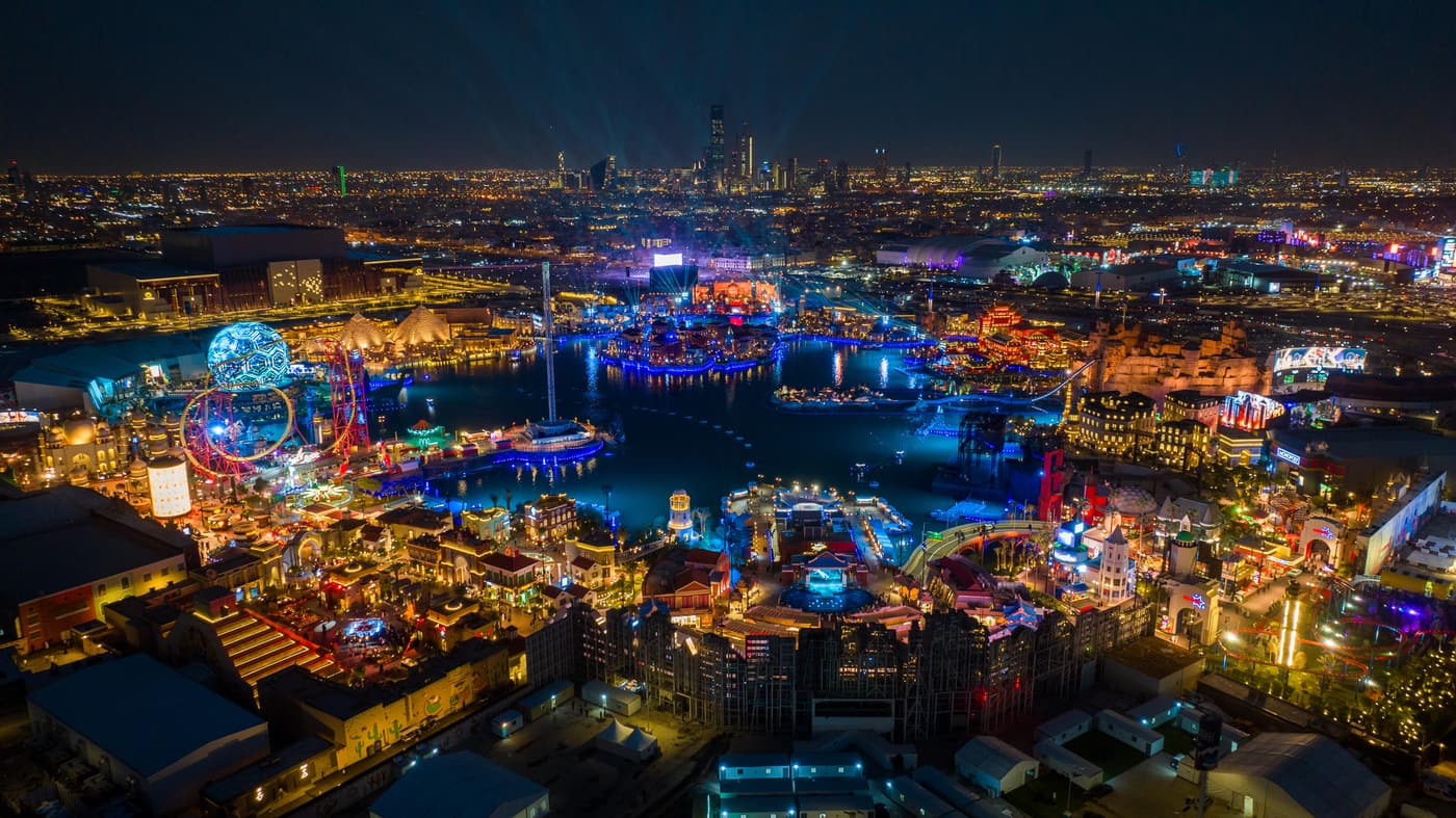 The illuminated zones of Boulevard World in Riyadh seen from above at night