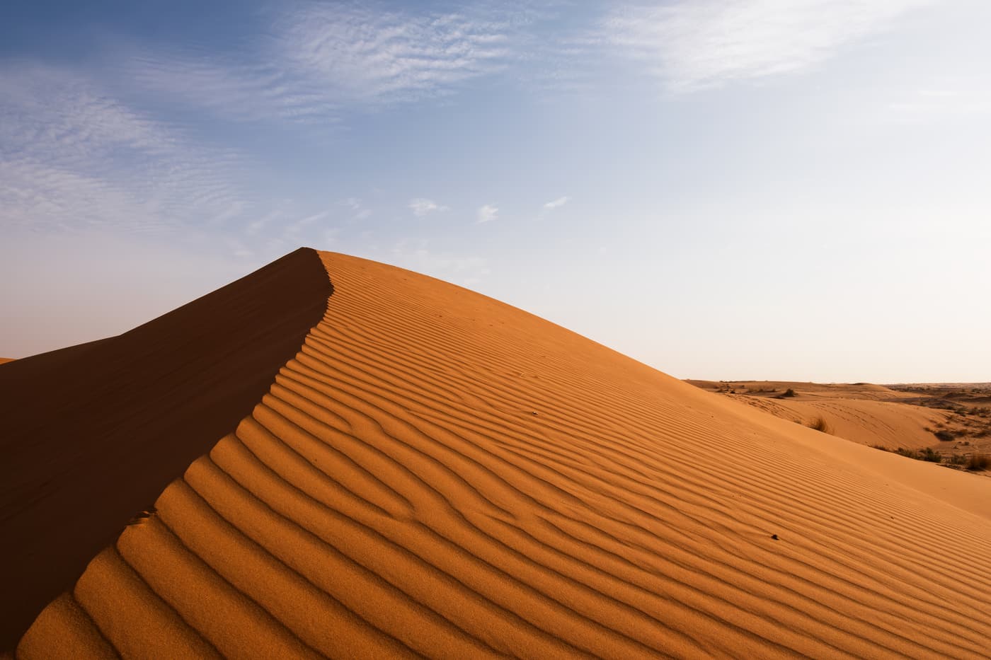 Wind-rippled red sand dunes in the desert of central Saudi Arabia
