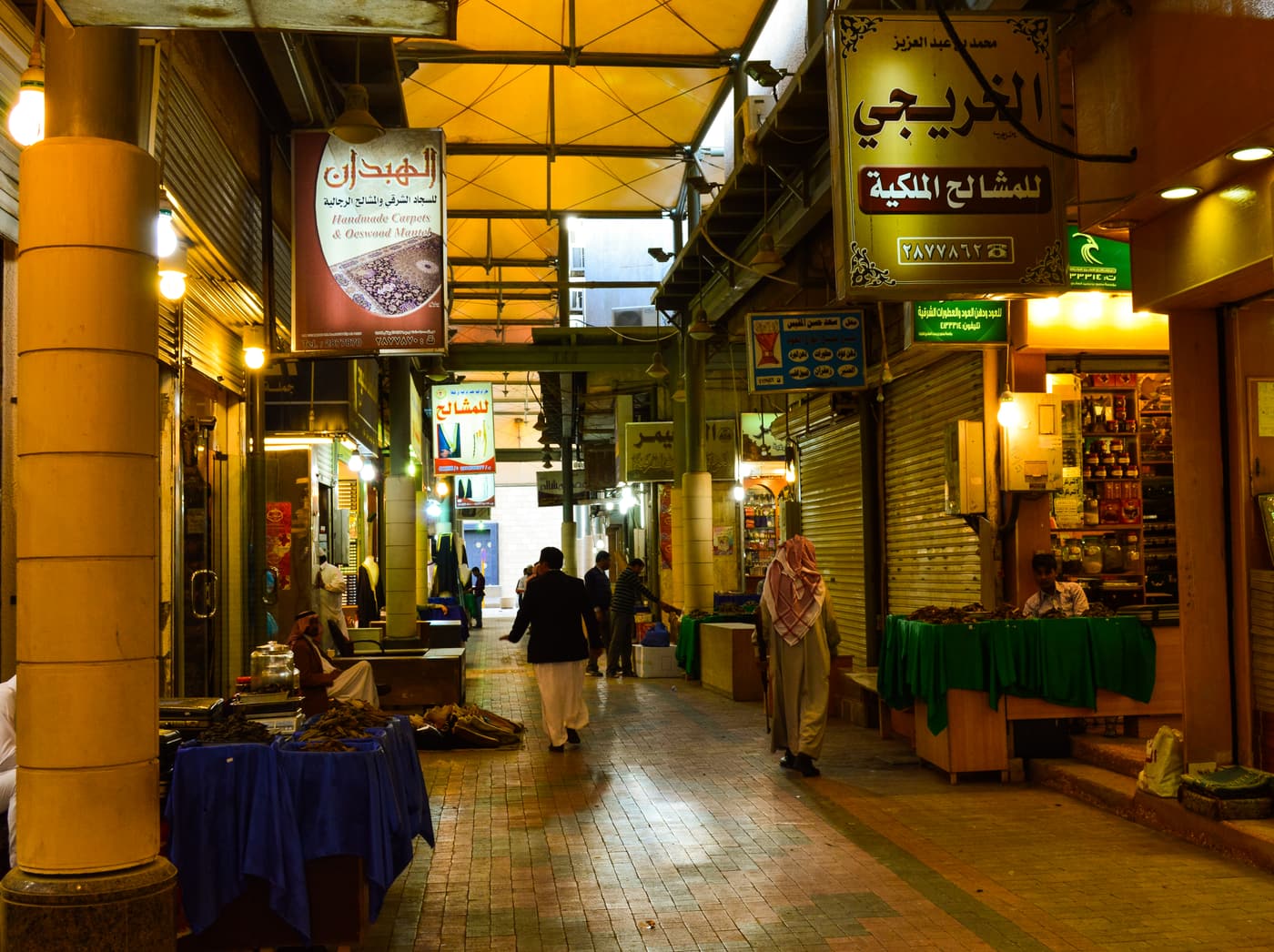 A covered lane of incense and perfume shops in a souq in downtown Riyadh