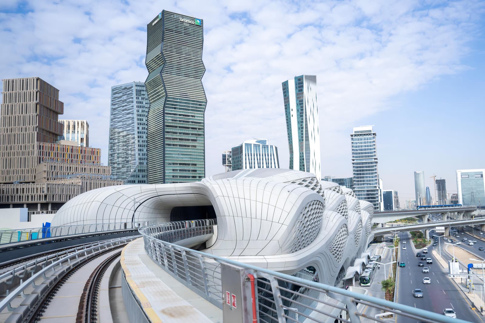 A Riyadh Metro viaduct and station in front of the KAFD towers